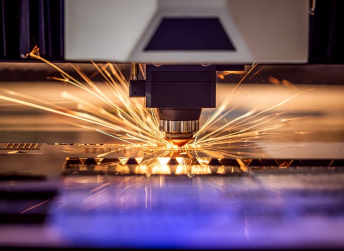 CNC Laser cutting of metal modern industrial technology. Laser cutting works by directing the output of a high-power laser through optics. Laser optics and CNC computer numerical control.